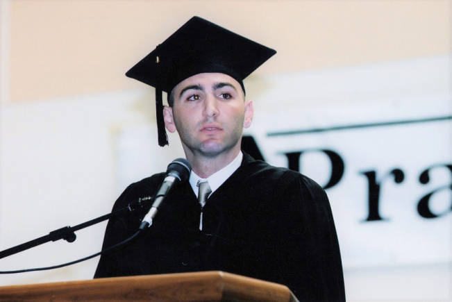 Man giving a graduation speech in 2000